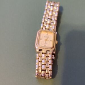 Gold Smartwatch with Elegant Square Face and Intricate Band